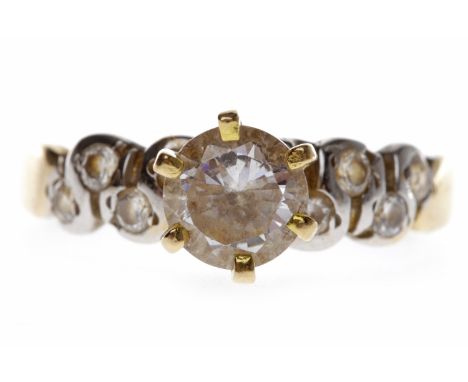 GEM SET DRESS RINGwith a high set round white stone 6.5mm diameter, with further round white gems to the shoulders, unmarked,