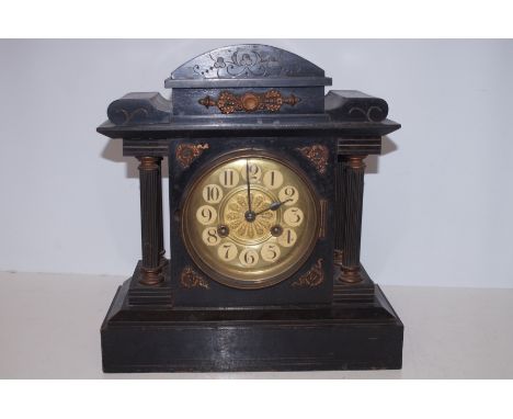 Victorian mantle clock with wooden case, currently ticking. Height 35 cm 