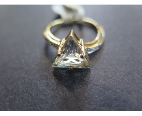 A 9ct yellow gold topaz and diamond ring - Size N - approx 3 grams - light scratches and usage wear otherwise good 