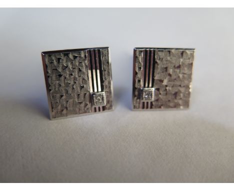 A pair of 9ct white gold diamond set cufflinks with engraved decoration - approx 6.8 grams - in good condition 