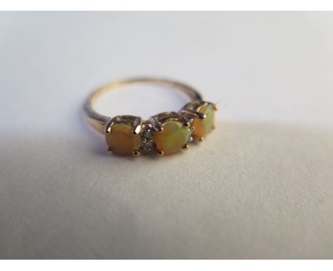 A 9ct opal and diamond ring - size N - approx 1.9 grams - in good condition 