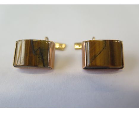 A pair of hallmarked 9ct yellow gold tigers eye cufflinks, 18mm x 12mm, total weight approx 13.5 grams 