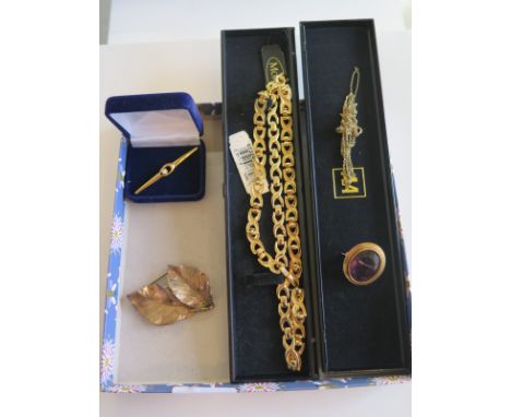 A small collection of antique and modern costume jewellery to include a rolled gold or gold filled amethyst brooch, Tilla of 