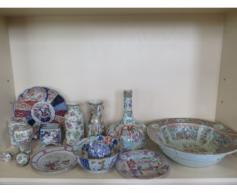 A collection of eleven  pieces of Oriental ware and a carpet ball all with either chips or cracks and stapled repairs except 