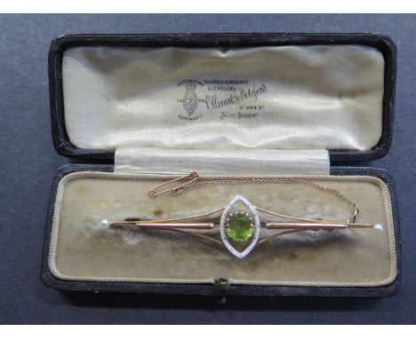 A yellow gold peridot enamel and pearl brooch, test to approx 9ct, - 8cm long approx 7.7 grams in good condition with origina