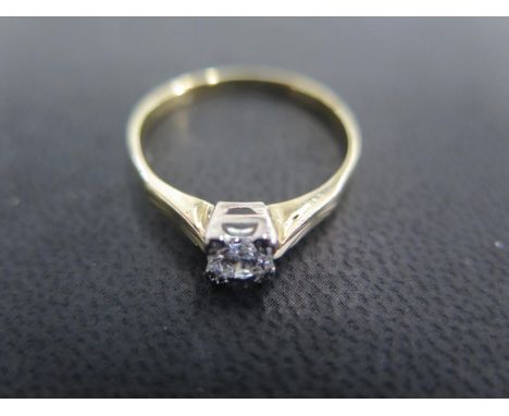 An 18ct yellow gold solitaire ring size R - approx weight 2.3 grams - total diamond weight approx 0.4ct - light surface scrat