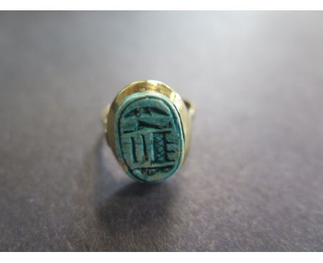 A yellow gold scarab ring size J/K - aprox 3.8 grams slight chipping to scarab otherwise good condition 