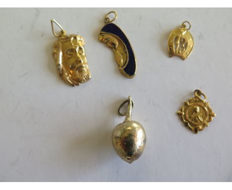 A collection of four 18ct gold and one silver Egyptian charms including Madonna inlaid with enamel, face of Christ flask and 