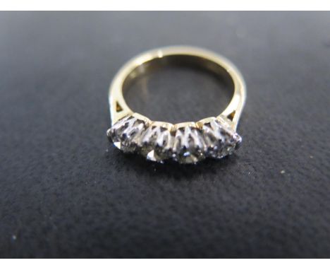 An 18ct yellow gold four stone diamond ring size H/I - approx weight 2.9 grams - total diamond weight approx 0.6ct - light su