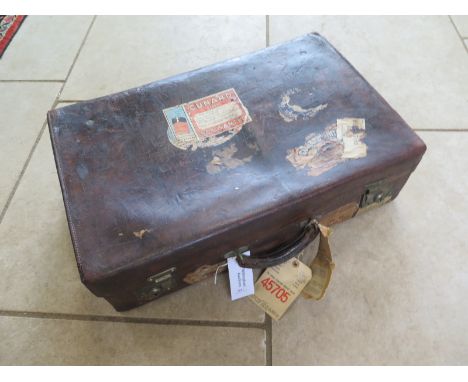 A good quality vintage leather suitcase by Army and Navy Cooperative with interesting Cunard line labels - 66cm wide, 17cm ta
