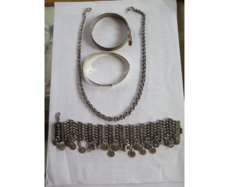 A selection of silver and white metal bracelets bangles and a neck;ace, one sterling, an Egyptian style piece, tested as silv