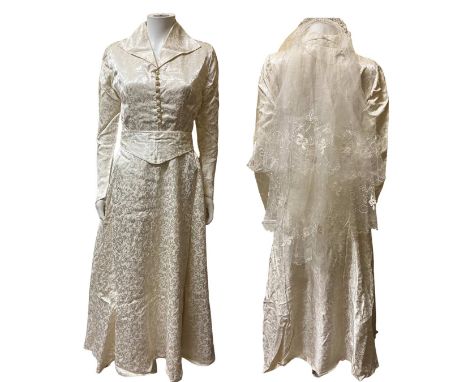 A full length wedding gown from 1957 in its original C&A box to include veiled headband and other pieces of traditional weddi