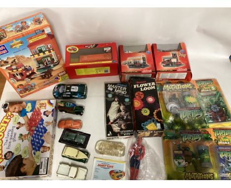 A selection of shucco car sets and a larger scale Britains farm set, ninja turtle figures toys and Mega blocks and lots of lo