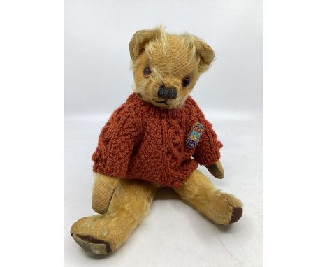 Antique Chad valley 12&rdquo; golden teddy bear with shield stitch snout and amber glass eyes , and cup ears and Butlins at F