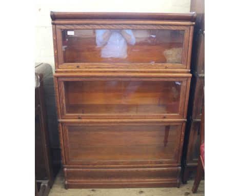 An oak three tiered Globe Wernicke glazed bookcase