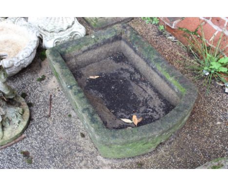 A weathered early stone basin