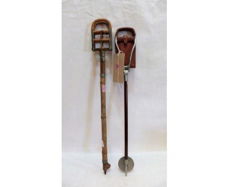A bamboo shooting stick and a metal example