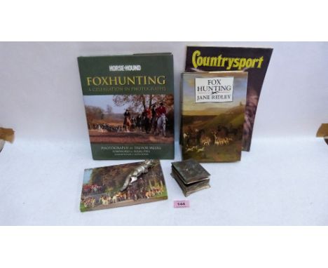 Two fox hunting volumes, a silver plated fox etc.