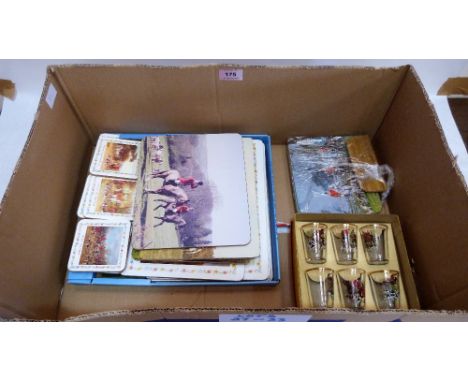 A collection of place mats with views of hunting including the Ludlow Hunt and a set of six shot glasses