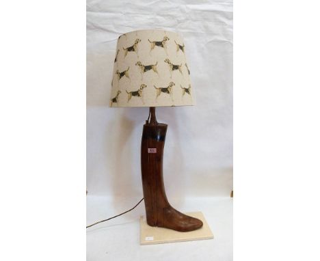 An unusual boot tree lamp with shade decorated with hounds