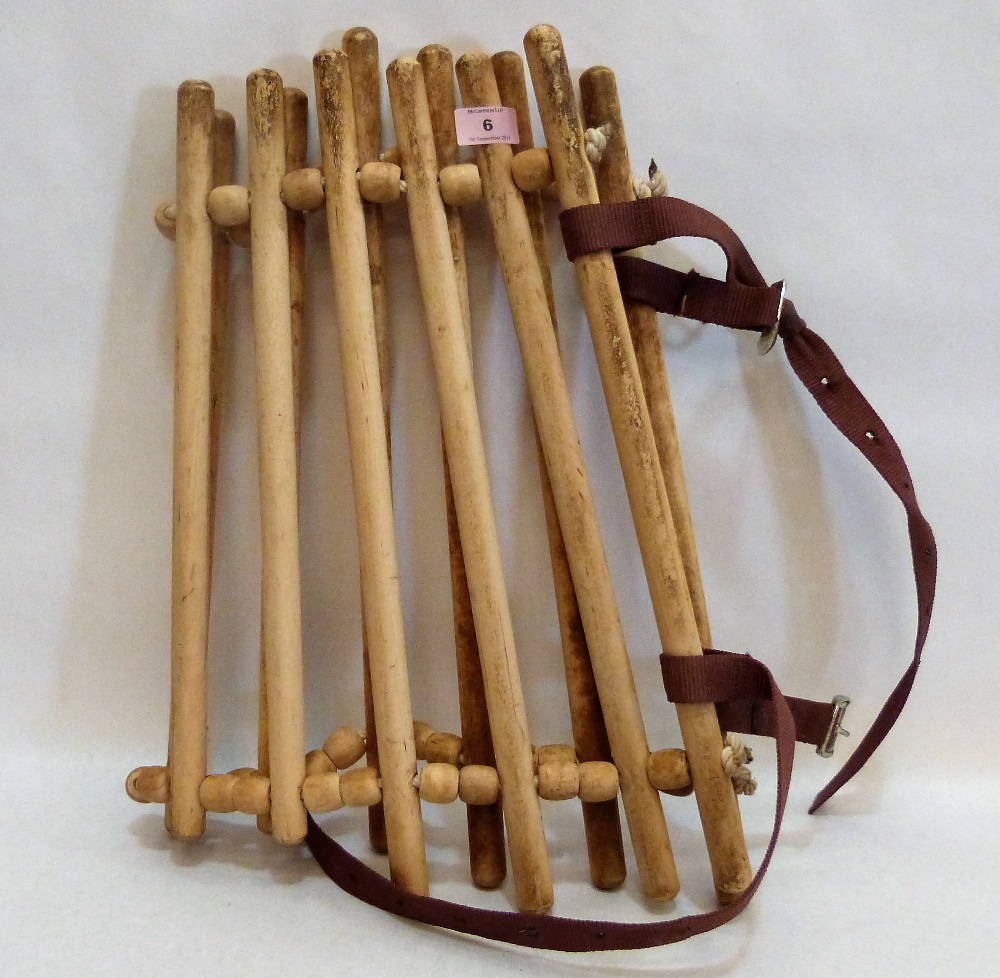 A wooden horse neck cradle