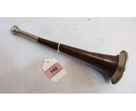 A copper and white metal hunting horn, stamped maker's mark for Henry Distin, Great Newport St, London. 10'' long