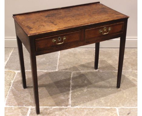 A George III oak and mahogany crossbanded side table, outlined with ebony and boxwood stringing, the twin plank moulded top o