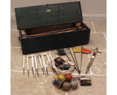 A Jacques croquet 'De Luxe' set, late 19th/early 20th century, to include; six painted iron hoops, five impressed 'Roehampton