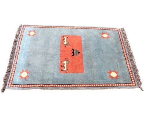 A thick wool pile hand woven traditional Persian Gabbeh rug, the central terracotta ground with twin zoomorphic motifs, 213cm