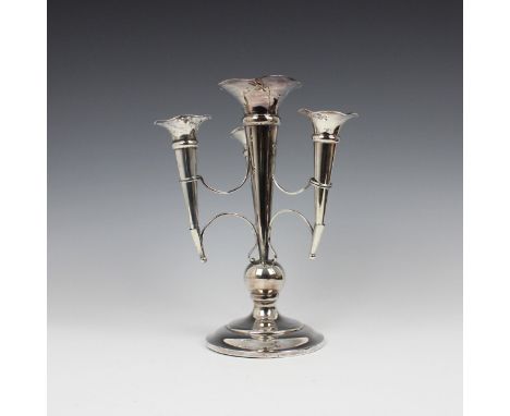 A George V silver epergne, indistinct makers mark, Birmingham 1912, the central tapering flared stem with three further confo