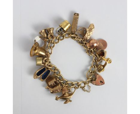 A yellow metal charm bracelet, the curb link bracelet suspending eighteen gold coloured and yellow metal charms, including a 