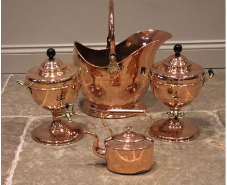 A selection of Country House copper wares to include, a near pair of Victorian copper samovars, each with applied ebonised an