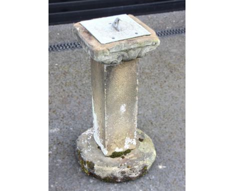 A sandstone pedestal sundial, the later associated dial upon a cubic form column and a circular plinth, 66cm H x 26cm Sq