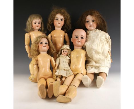 Armand Marseille, six 390 model dolls, to include size 246/1, 10, 6, 4, 3, and 6/0, each with rolling eyes in blue and brown,