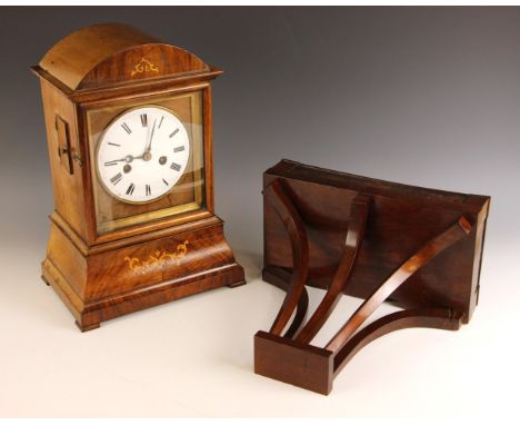 A mid 19th century South German walnut eight day bracket clock, the domed and inlaid case enclosing the 14cm enamelled dial a