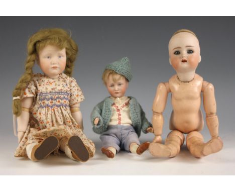 Kämmer & Reinhardt, Simon & Halbig, a bisque headed doll, with open blue glass eyes, and open mouth showing upper teeth, comp