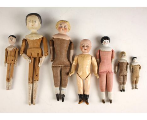 Two Naïve peg type dolls, each with painted features, and articulated limbs, with four porcelain head and shoulder dolls, eac