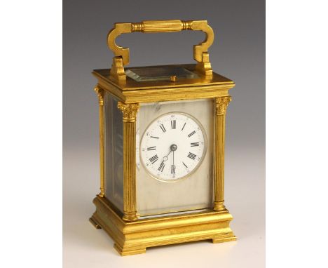 A French brass repeating carriage clock by E Maurice & Co, Paris, early 20th century, the brass case formed with cast Corinth