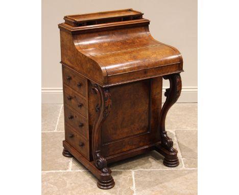 A Victorian figured walnut piano top davenport, having a rising compartmented gallery (at fault), over the curved fall front 