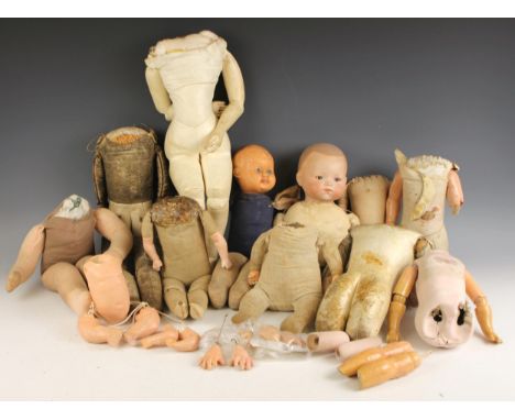 A large quantity of incomplete dolls and doll parts, 19th century and later, predominantly including, legs, torsos, arms, hea