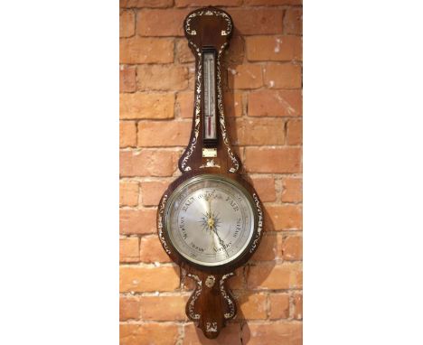 A Victorian rosewood and mother of pearl inlaid mercury wheel barometer, the foliate inlaid case applied with an ivorine plaq