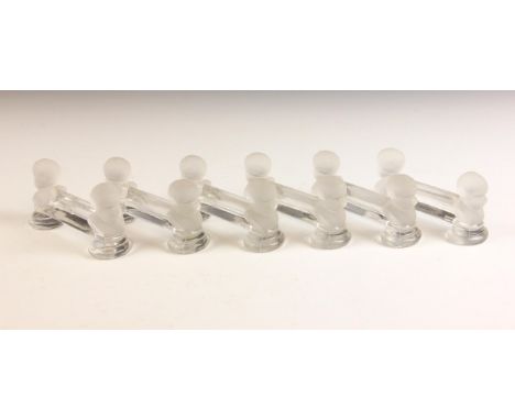Six glass figural knife rests, probably Baccarat, early 20th century, each modelled with two putti busts, 10cm W x 3cm D x 5c
