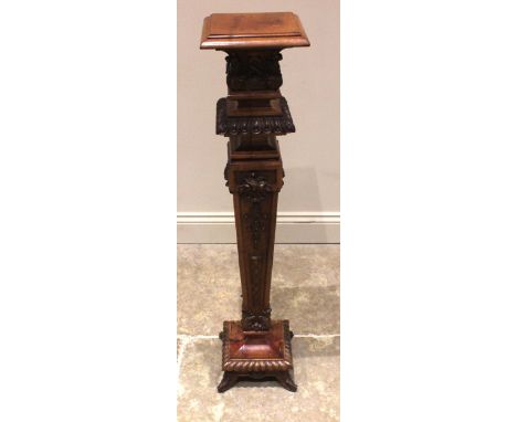 An Italian caved hardwood pedestal, 20th century, relief carved with shells, acanthus and graduated hare bell detail to a tap