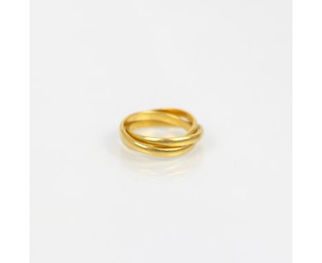 A yellow metal Middle Eastern Russian wedding band, the triple interlocking plain polished band with indistinct mark to inter