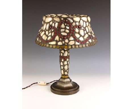 An Arts and Crafts shell and glass bead lamp in the manner of Montelius, circa 1910, the circular shade with leaded shell and