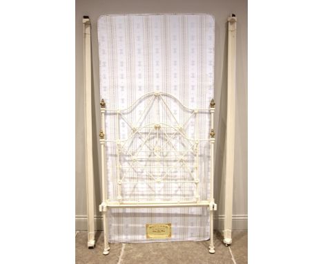 A Victorian painted iron bedstead by Seventh Heaven, the iron work frames applied with brass finials, 92cm wide, along with s