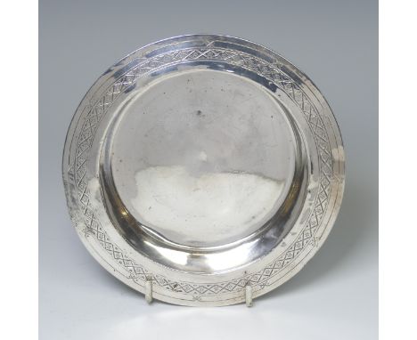 Liberty &amp; Co.; A George V silver Bowl, hallmarked Birmingham 1914, the shallow circular centre with a wide rim with geome