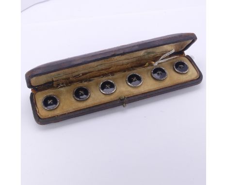 An antique cased set of six black onyx Buttons, mounted in silver with gilt reverses, in a fitted 'Liberty &amp; Co. Regent S