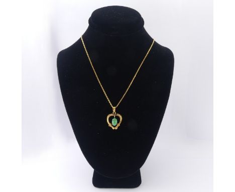 An Eastern heart shaped jade Pendant,&nbsp;15mm wide, on a high carat gold chain, all marked '22k', tested as probably 18ct, 