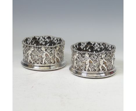 A pair of Victorian silver Wine Coasters, by&nbsp;Roberts &amp; Briggs, hallmarked Sheffield 1860, pierced with cherubs carry